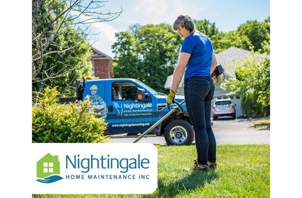 Woman trimming grass around a garden