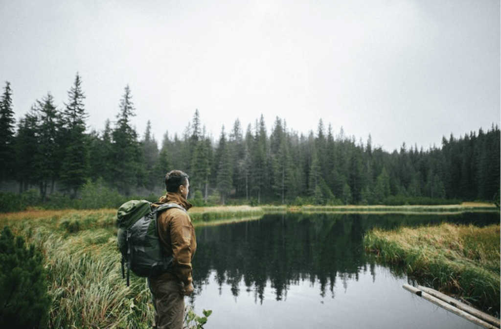 Man standing by a river